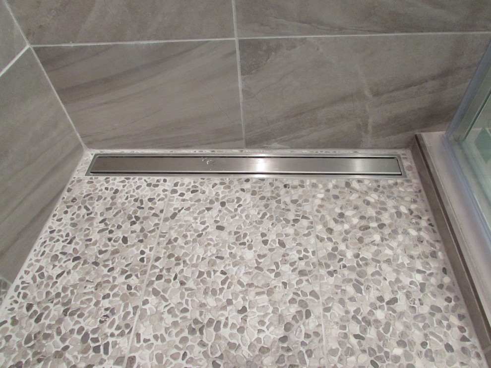 This is an example of a small modern master bathroom in Other with an alcove shower and brown tile.