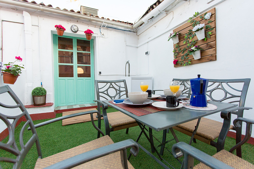 Inspiration for a small transitional rooftop deck in Seville.