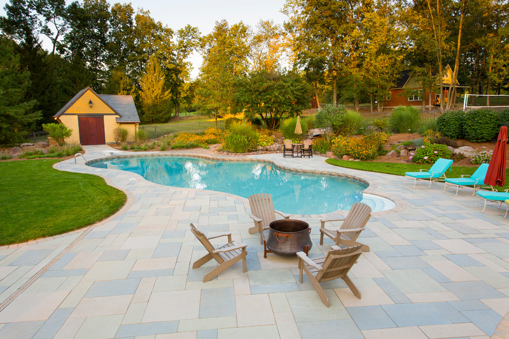 Inspiration for a mid-sized transitional backyard tile and kidney-shaped pool house remodel
