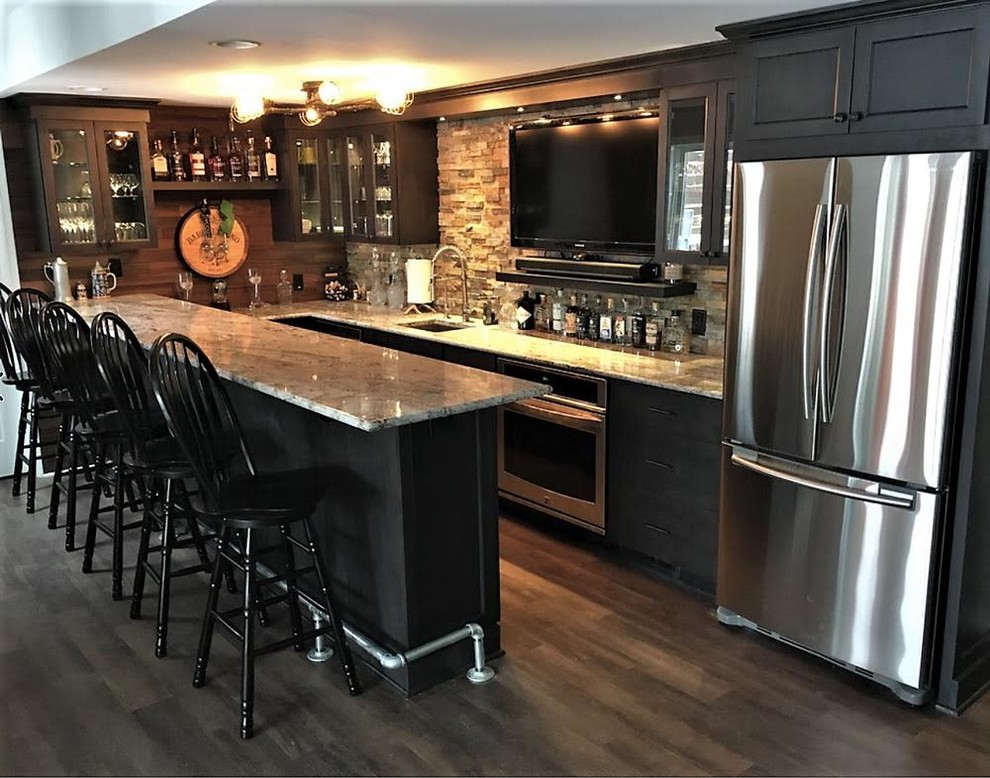 Large contemporary u-shaped seated home bar in Milwaukee with an undermount sink, glass-front cabinets, dark wood cabinets, granite benchtops, brown splashback, timber splashback, medium hardwood floors and brown floor.