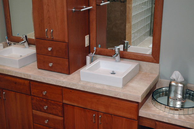Photo of a contemporary bathroom in Portland with a vessel sink, shaker cabinets, medium wood cabinets and blue walls.