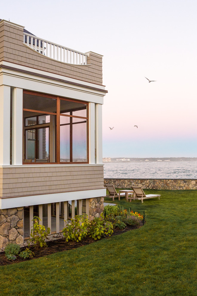 This is an example of a beach style exterior in Portland Maine.
