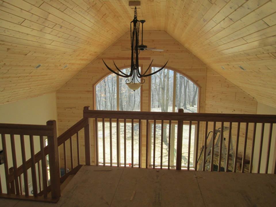 Example of a mountain style home design design in Milwaukee