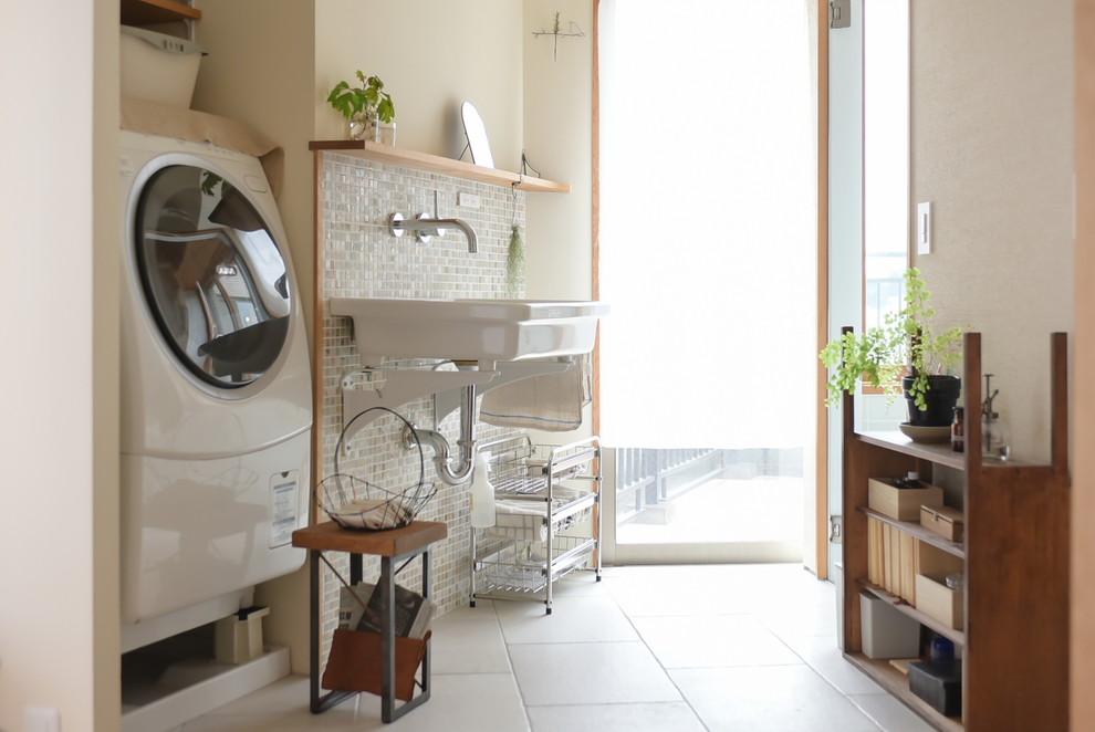 This is an example of an asian laundry room in Tokyo with white walls and white floor.