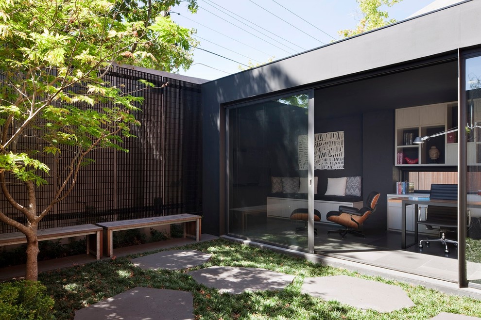 Inspiration for a mid-sized contemporary home studio in Melbourne with grey walls, ceramic floors, no fireplace and a built-in desk.