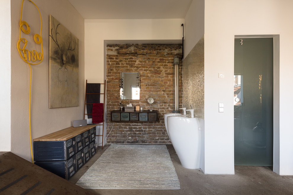 This is an example of an eclectic bathroom in Berlin with white walls, concrete floors, a pedestal sink and grey floor.