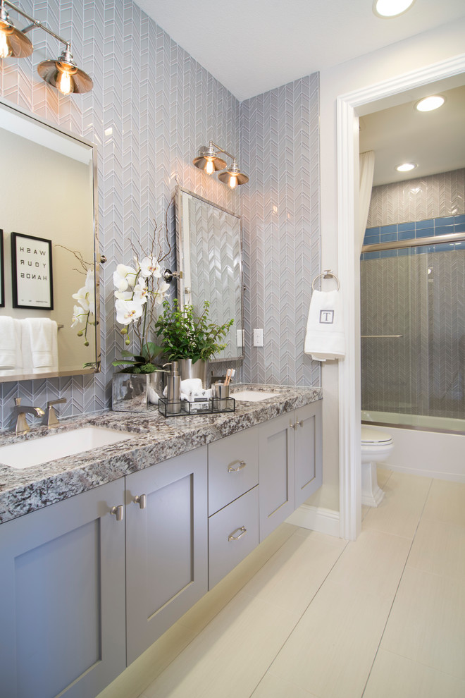 Photo of a transitional bathroom in San Francisco with shaker cabinets and grey cabinets.