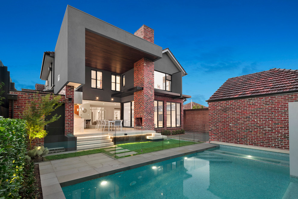 Large transitional two-storey brick multi-coloured exterior in Melbourne.