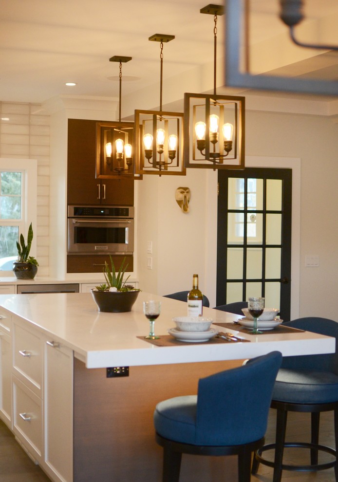 Example of a transitional kitchen design in Calgary