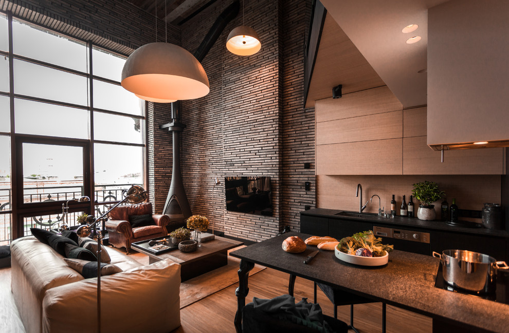 This is an example of an industrial formal open concept living room in Moscow with a wall-mounted tv, grey walls, medium hardwood floors, a corner fireplace, a metal fireplace surround and brown floor.