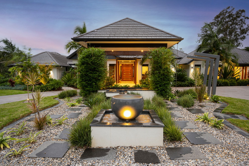Design ideas for an expansive world-inspired front garden in Sydney.