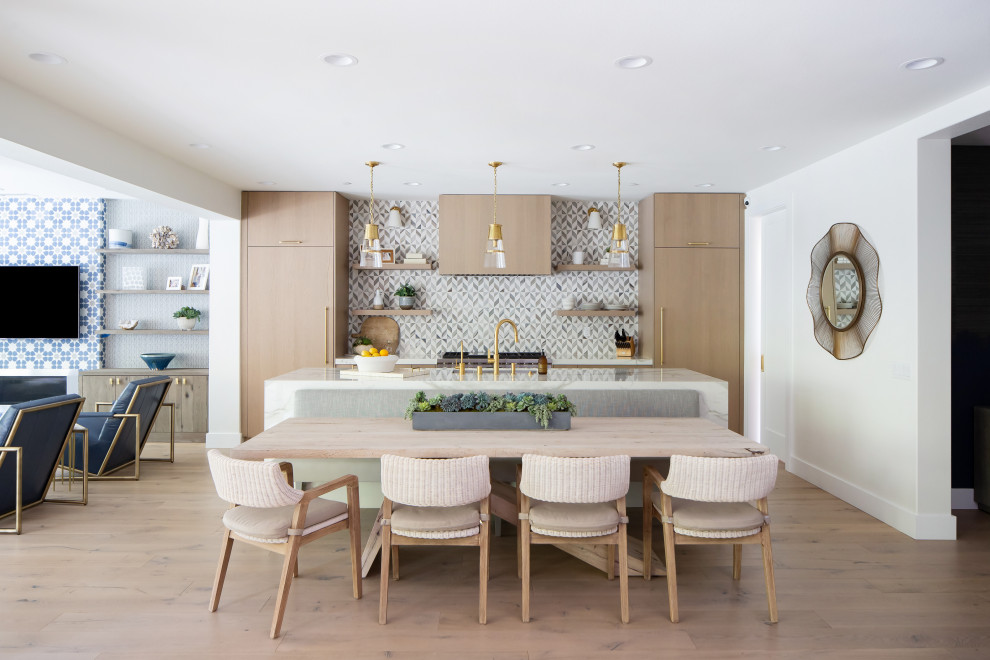 Contemporary eat-in kitchen in Orange County with flat-panel cabinets, medium wood cabinets, multi-coloured splashback, panelled appliances, medium hardwood floors, with island, brown floor and multi-coloured benchtop.