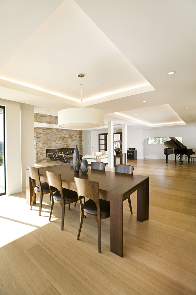 Design ideas for a contemporary open plan dining in San Francisco with bamboo floors.