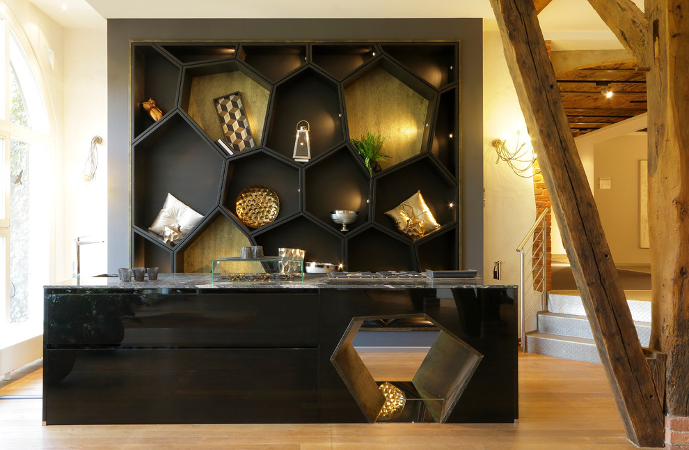Inspiration for a small modern single-wall open plan kitchen in Stuttgart with black cabinets and with island.
