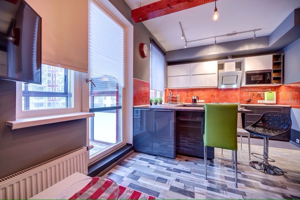 Photo of a medium sized contemporary u-shaped kitchen/diner in Saint Petersburg with a double-bowl sink, flat-panel cabinets, grey cabinets, laminate countertops, red splashback, white appliances, ceramic flooring and a breakfast bar.