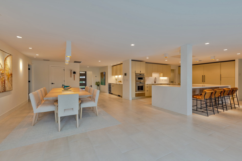 Open‑Concept Kitchen with Island Seating - Dining Room - Tampa - by ...