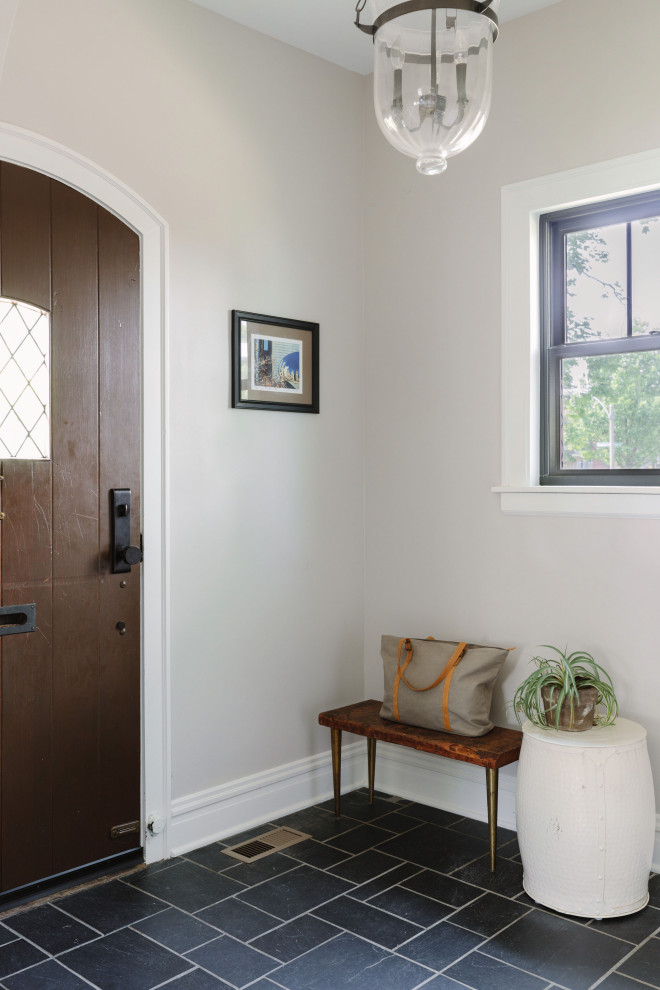Inspiration for a transitional slate floor and black floor single front door remodel in Chicago with gray walls and a medium wood front door