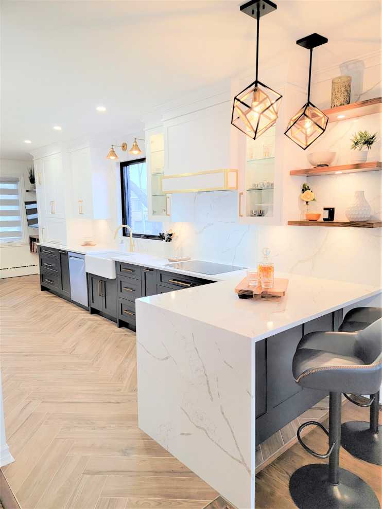 Inspiration for a mid-sized transitional galley porcelain tile and brown floor eat-in kitchen remodel in Montreal with an undermount sink, shaker cabinets, blue cabinets, quartz countertops, white backsplash, quartz backsplash, stainless steel appliances, a peninsula and white countertops