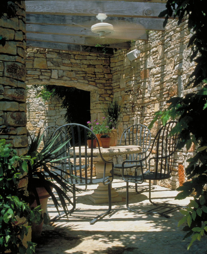 Photo of a mediterranean patio in Austin with a pergola.