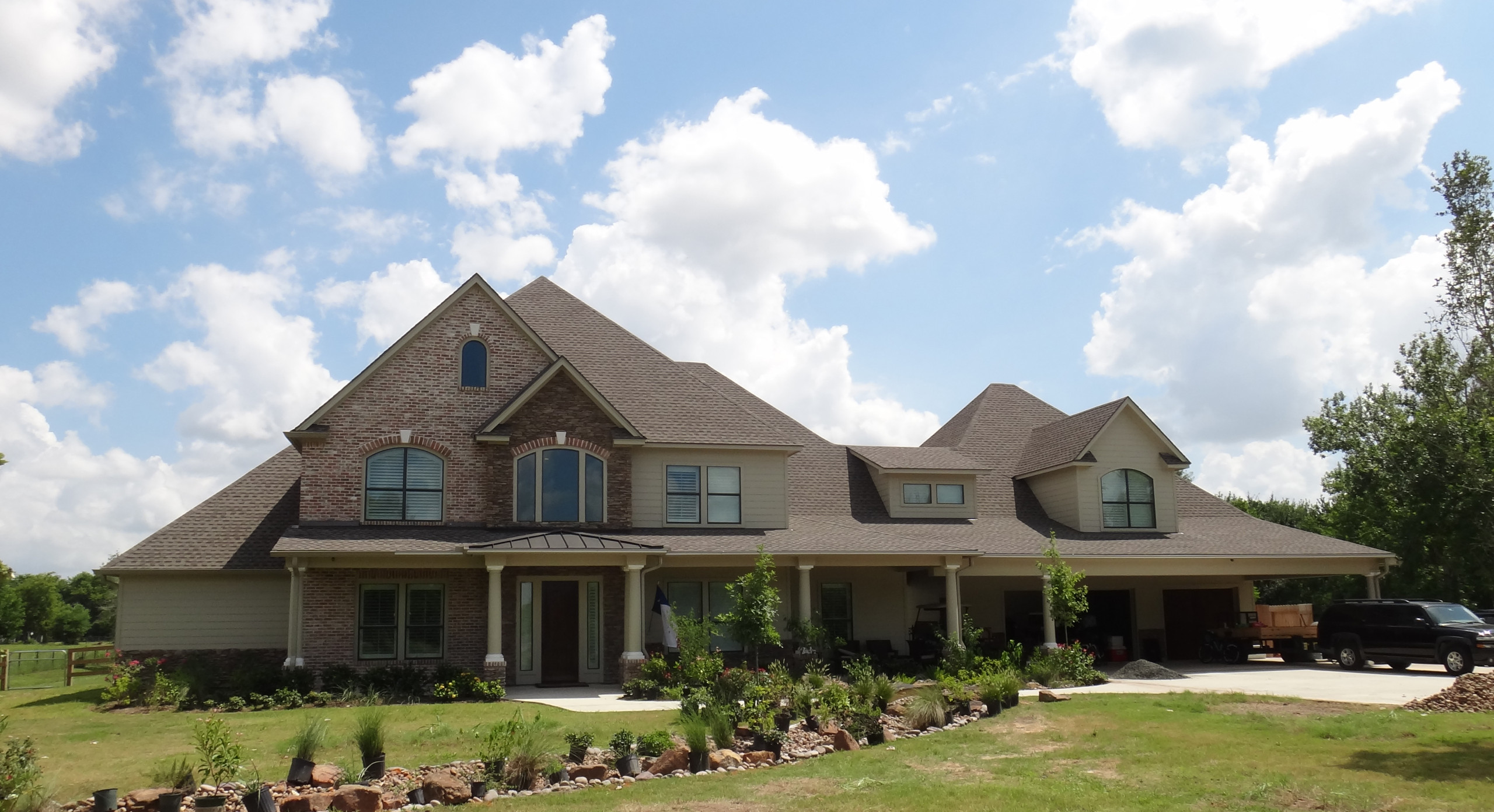 Traditional exterior with stone, brick, and siding