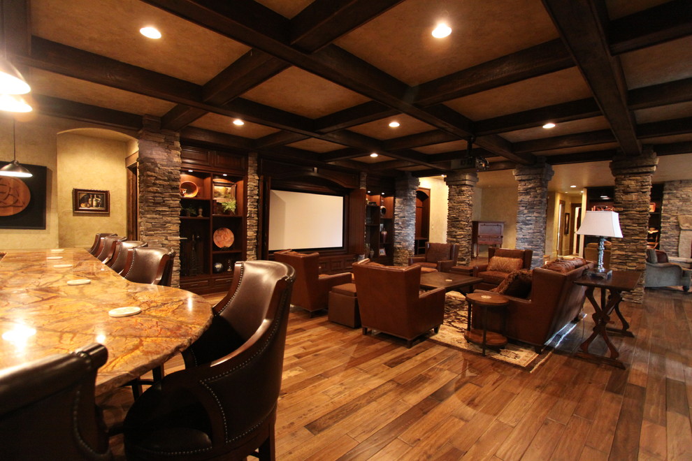 Photo of a large country open concept family room in Charlotte with beige walls, dark hardwood floors, a built-in media wall and brown floor.
