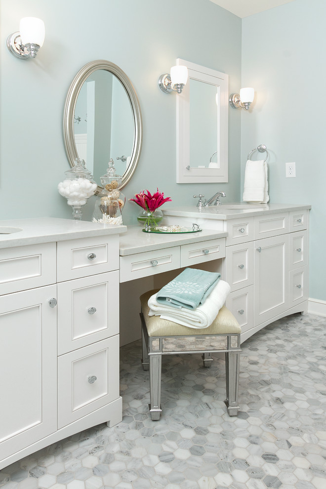 This is an example of a traditional bathroom in Minneapolis with white cabinets.