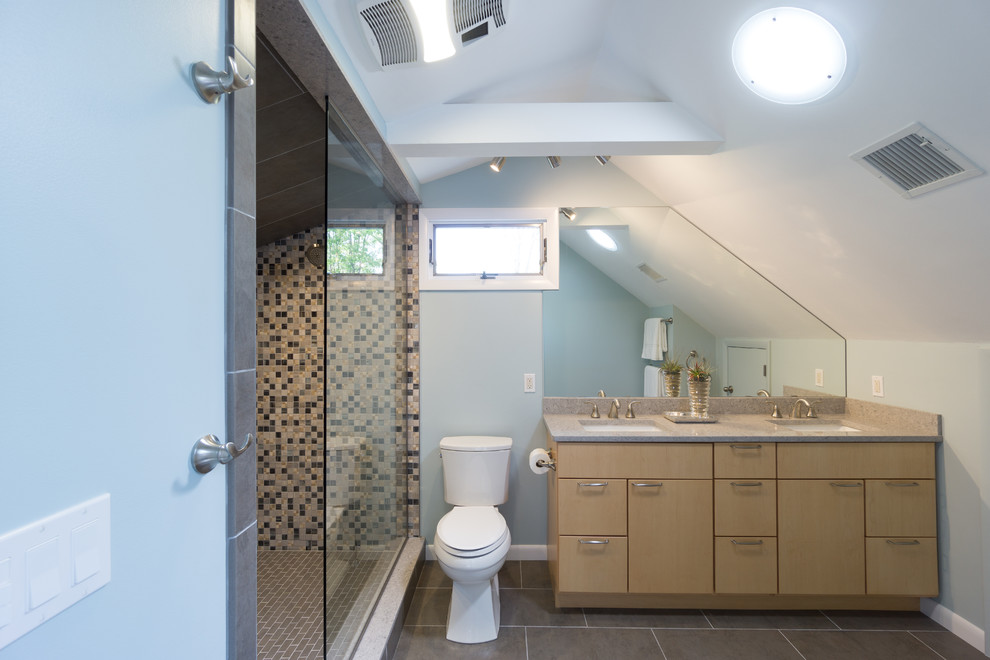 Photo of a mid-sized modern master bathroom in Providence with flat-panel cabinets, light wood cabinets, engineered quartz benchtops, gray tile, porcelain tile, an open shower, a two-piece toilet, an undermount sink, blue walls and porcelain floors.