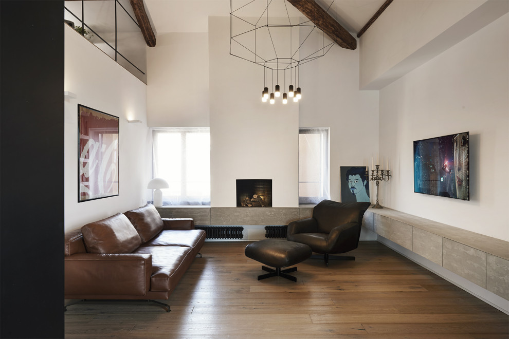 This is an example of a contemporary living room in Rome with white walls, light hardwood flooring, a coffered ceiling and brick walls.