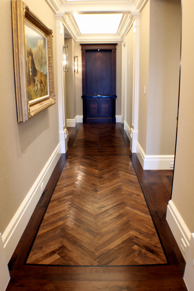 Inspiration for an expansive traditional hallway in Salt Lake City with beige walls and dark hardwood floors.