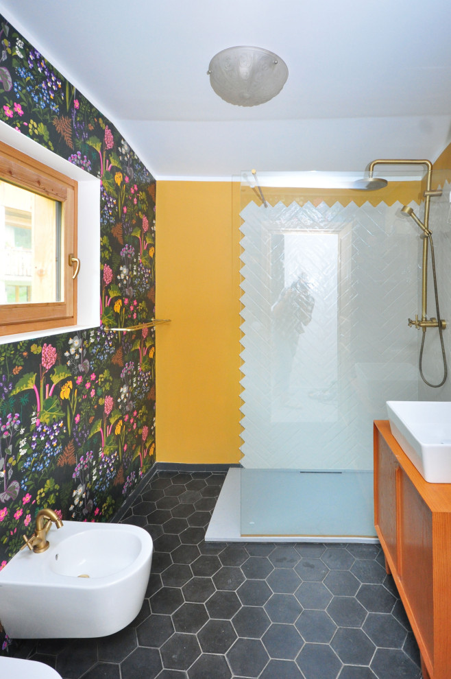 Photo of a small bohemian ensuite bathroom in Lyon with a corner shower, a wall mounted toilet, white tiles, porcelain tiles, white walls, cement flooring, a console sink, wooden worktops, white floors, a hinged door, a single sink, a freestanding vanity unit and flat-panel cabinets.