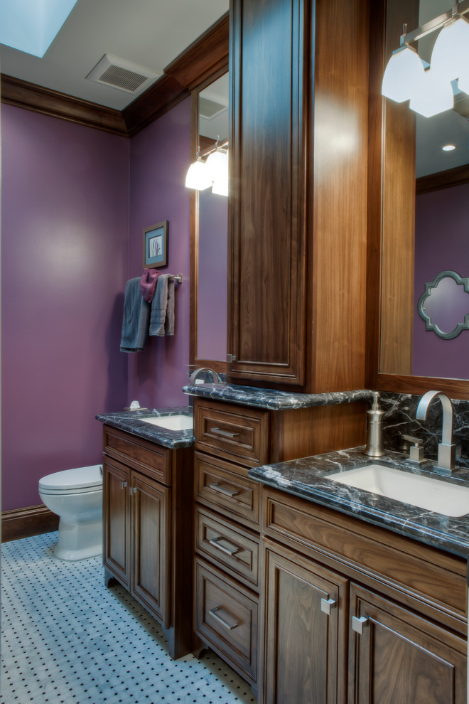 Inspiration for a small traditional master bathroom in San Francisco with recessed-panel cabinets, dark wood cabinets, a corner shower, purple walls, marble floors, an undermount sink, white floor and a hinged shower door.