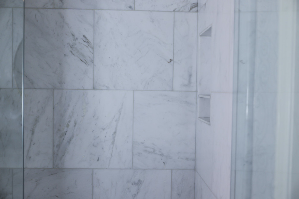 Alcove bathtub - mid-sized transitional master white tile and marble tile ceramic tile and gray floor alcove bathtub idea with gray walls, beaded inset cabinets, white cabinets, a two-piece toilet, an undermount sink, quartzite countertops and a hinged shower door