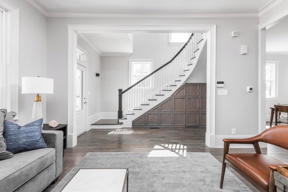 Photo of a large country foyer in Indianapolis with grey walls, medium hardwood floors, a single front door, a dark wood front door and grey floor.