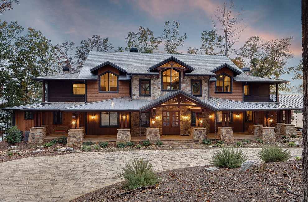 Mountain style brown two-story mixed siding gable roof photo with a mixed material roof