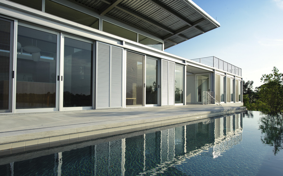 Design ideas for a large modern rectangular infinity pool in Miami.