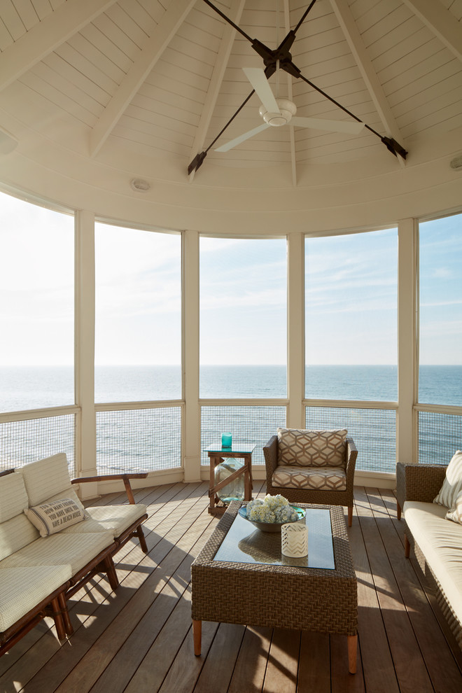 Beach style screened-in porch idea in Chicago with decking