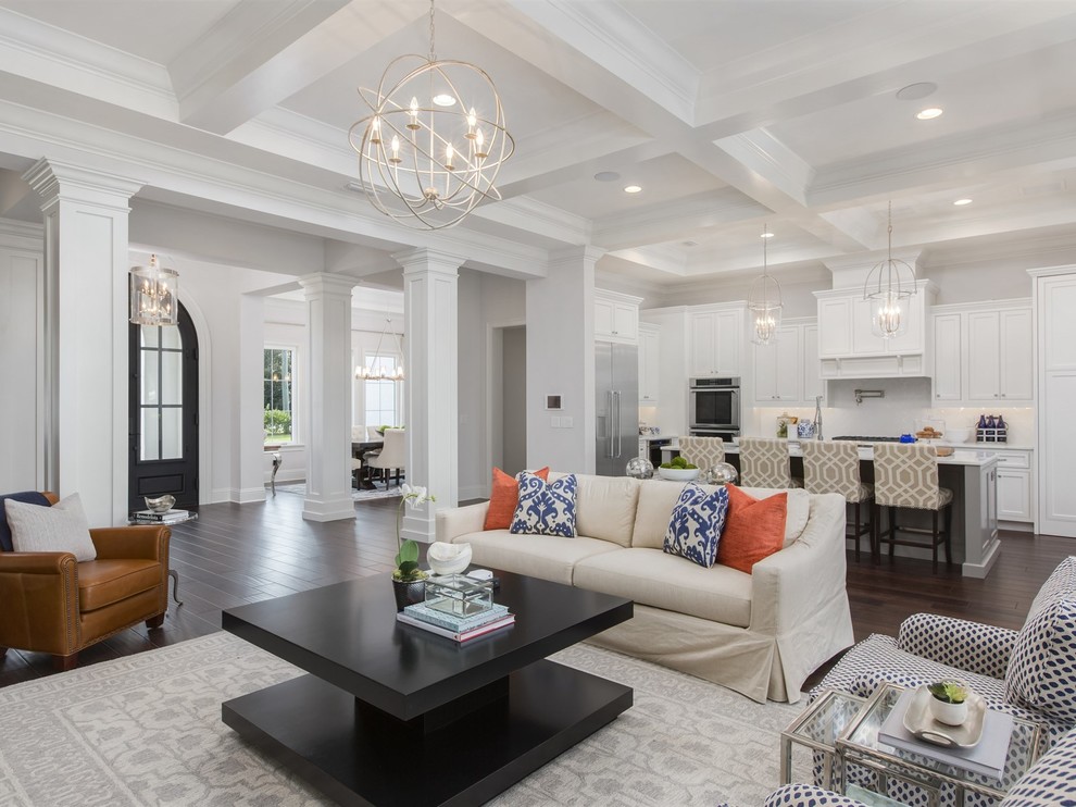 Inspiration for a large transitional family room in Orlando with white walls, dark hardwood floors, a standard fireplace, a stone fireplace surround and a built-in media wall.