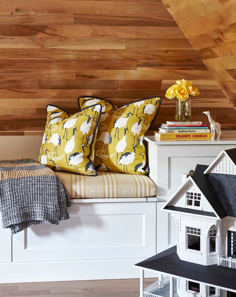 Inspiration for a mid-sized transitional gender-neutral kids' playroom for kids 4-10 years old in Toronto with medium hardwood floors and brown floor.