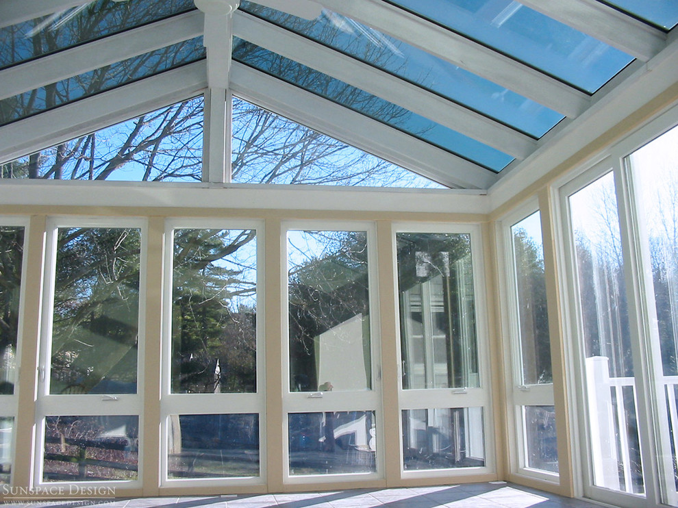 This is an example of a mid-sized contemporary sunroom in Boston with slate floors, no fireplace and a glass ceiling.