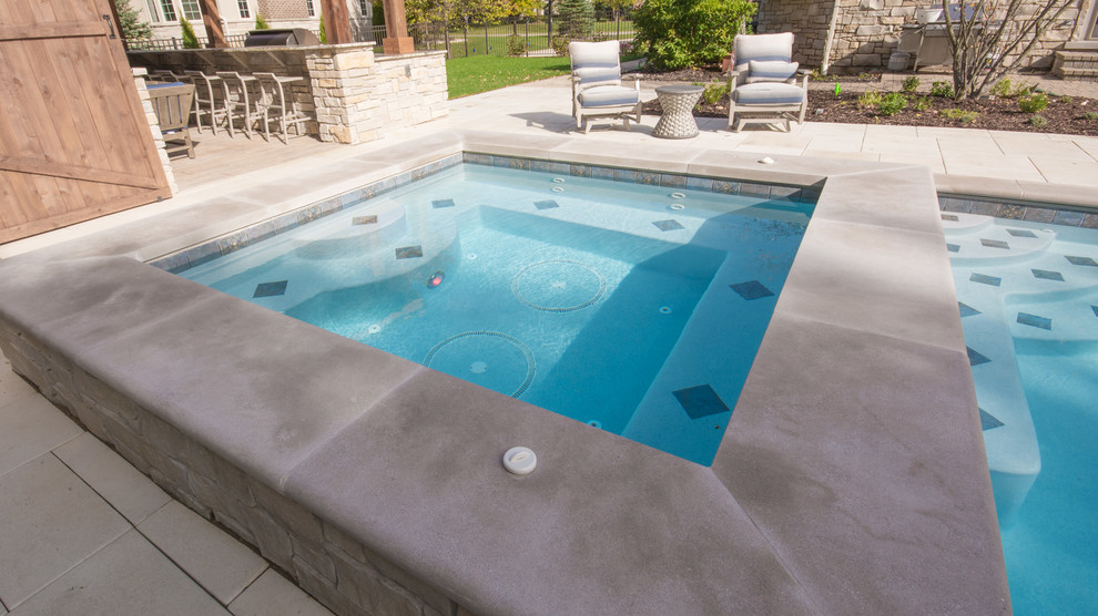 Inspiration for a large rustic backyard concrete paver and rectangular lap pool remodel in Chicago