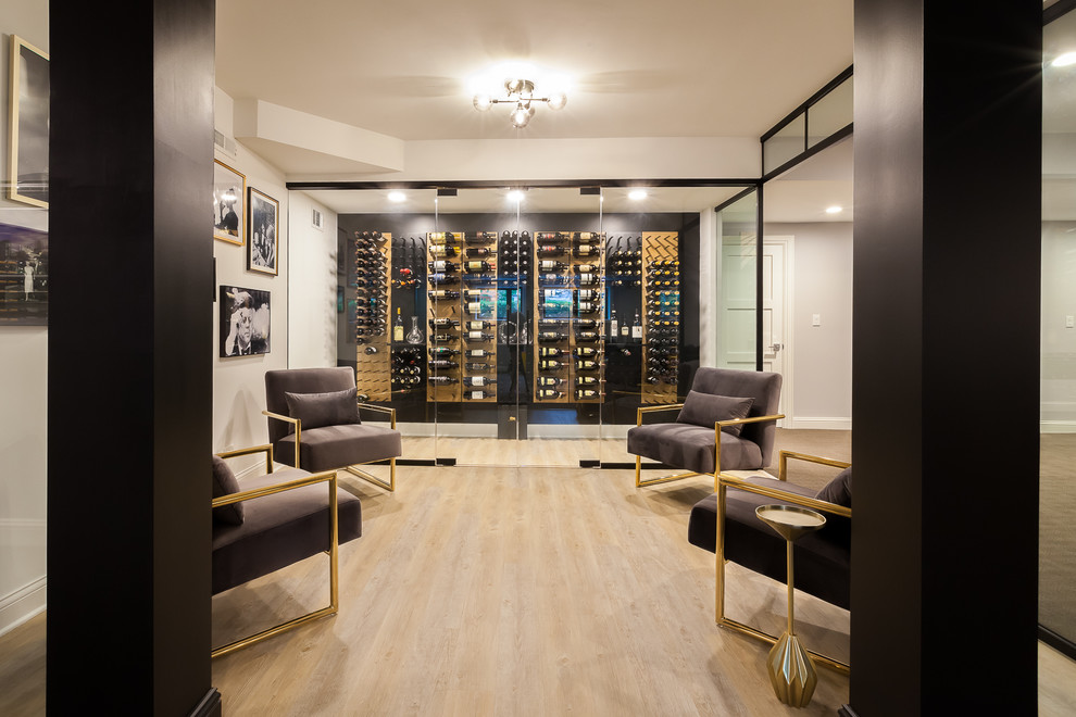 Photo of a large transitional wine cellar in Chicago with laminate floors, display racks and brown floor.