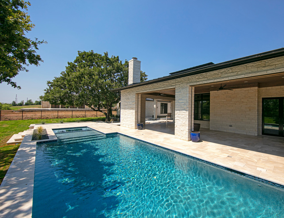Pool - huge transitional two-story white pool idea in Dallas