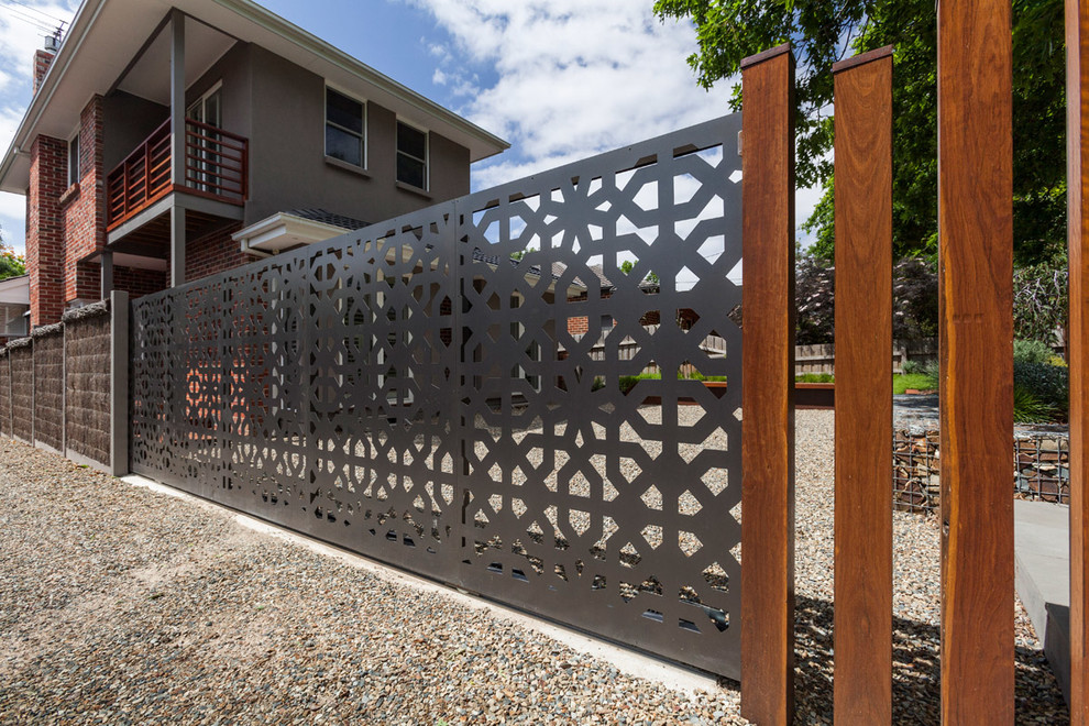 Large modern two-storey brown exterior in Melbourne with metal siding.