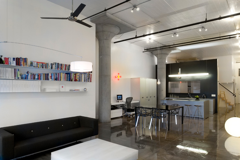 This is an example of an industrial living room in San Francisco with white walls.