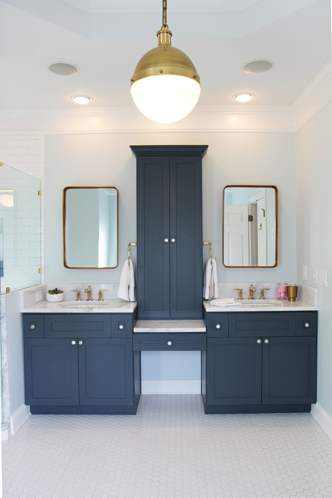 Photo of a large traditional master bathroom in Atlanta with shaker cabinets, blue cabinets, a claw-foot tub, a two-piece toilet, white tile, subway tile, blue walls, mosaic tile floors, an undermount sink and quartzite benchtops.