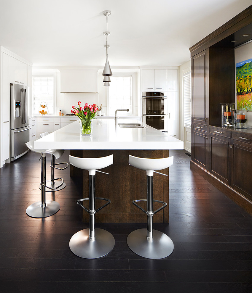 Design ideas for a contemporary kitchen in Toronto with white cabinets and with island.