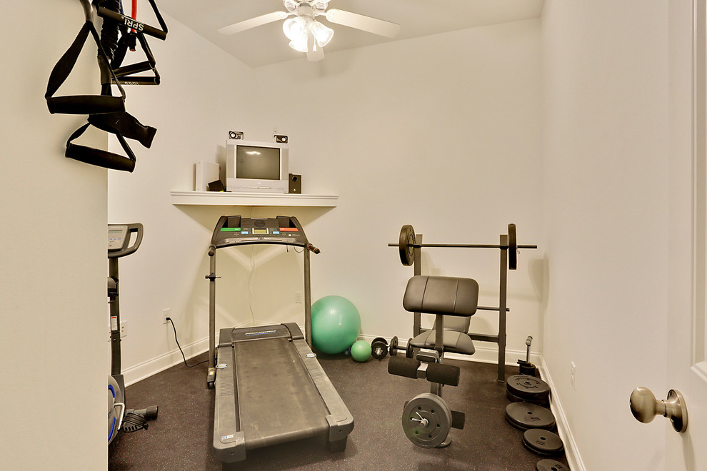 Photo of a small beach style multipurpose gym in New Orleans with white walls.