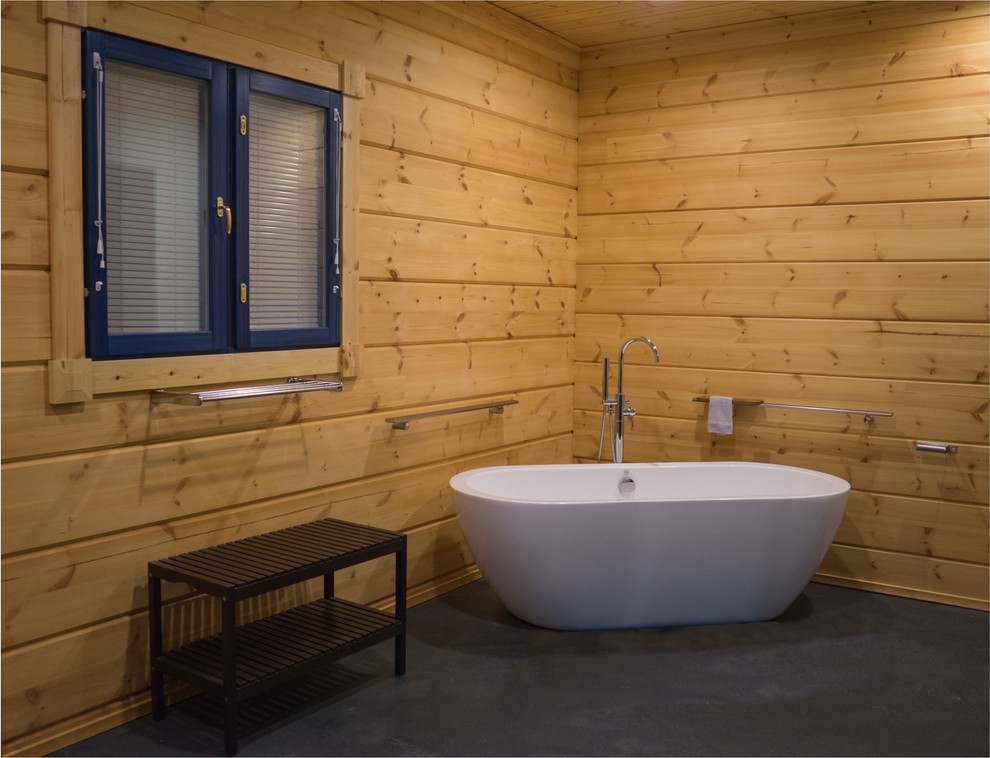 Freestanding bathtub - large rustic master concrete floor and gray floor freestanding bathtub idea with beige walls