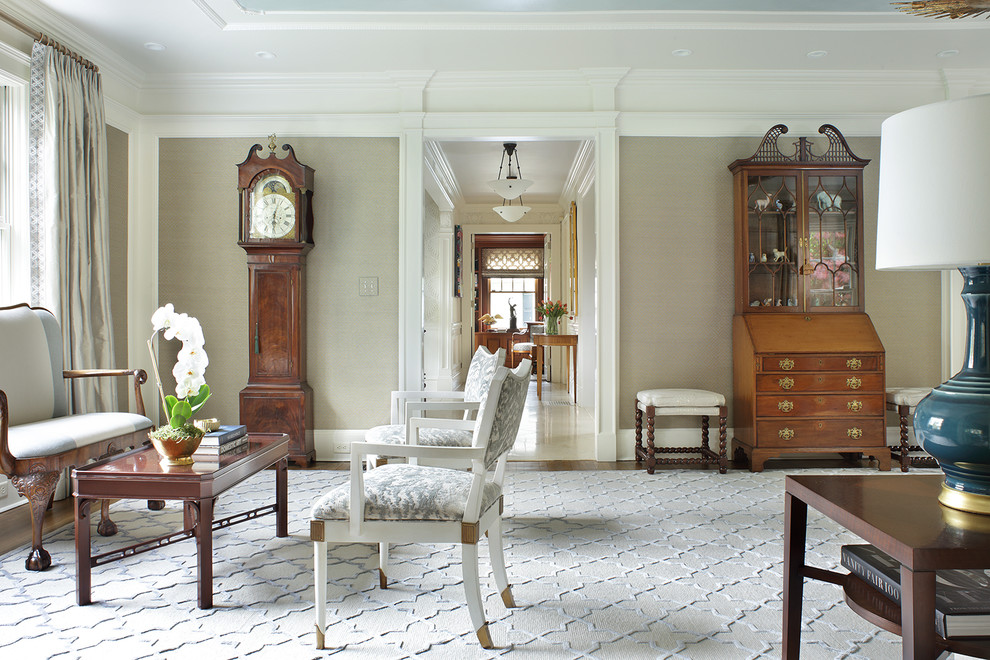 Living Room - A truly elegant living room combining antiques and contemporary pieces. Artwork above the sofa adds a focal point to the room. The old bones of this home were preserved while updating the decor for a modern transitional aesthetic. Photography by Peter Rymwid.