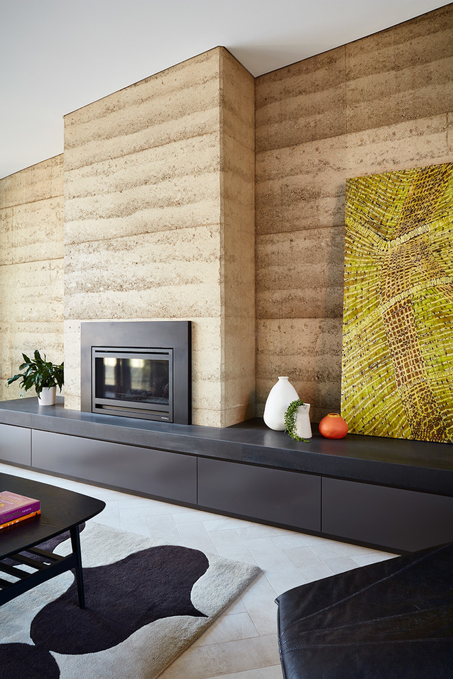 Photo of a contemporary living room in Melbourne with porcelain floors, a standard fireplace, beige walls, a metal fireplace surround and beige floor.